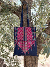 Load image into Gallery viewer, Tote bag with pink and blue geometric pattern hanging on a tree
