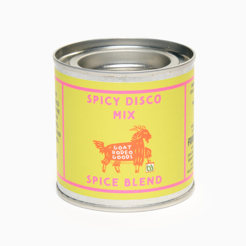 A tin container labeled 'Spicy Disco Mix Spice Blend' with a graphic of a goat, indicating the product is a spice mix from Goat Rodeo Goods.