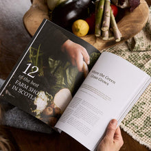 Load image into Gallery viewer, Open pages of Hidden Scotland magazine Spring Summer 2026 issue article about farm shops in Scotland with vegetables on a table.

