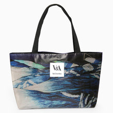 Load image into Gallery viewer, Upcycled exhibition banner landscape tote bag featuring blue graphic artwork and white V&amp;A Dundee logo patch.
