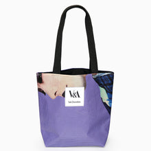 Load image into Gallery viewer, Portrait tote bag made from recycled PVC exhibition banner with blue graphic artwork and white V&amp;A Dundee logo.
