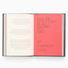 Load image into Gallery viewer, Open pages of Lee McQueen quote book showing bold red quote spread
