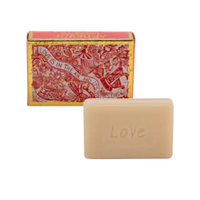 Load image into Gallery viewer, view of soap showing word LOVE with the red and gold illustrated gift box behind it . Packaging reads Love Is in the Air and It’s Disgusting with the brand name Arthouse Unlimited
