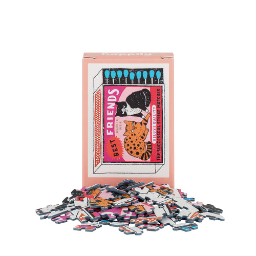 Puzzle pieces and packaging with 'Best Friends' illustration on a white background