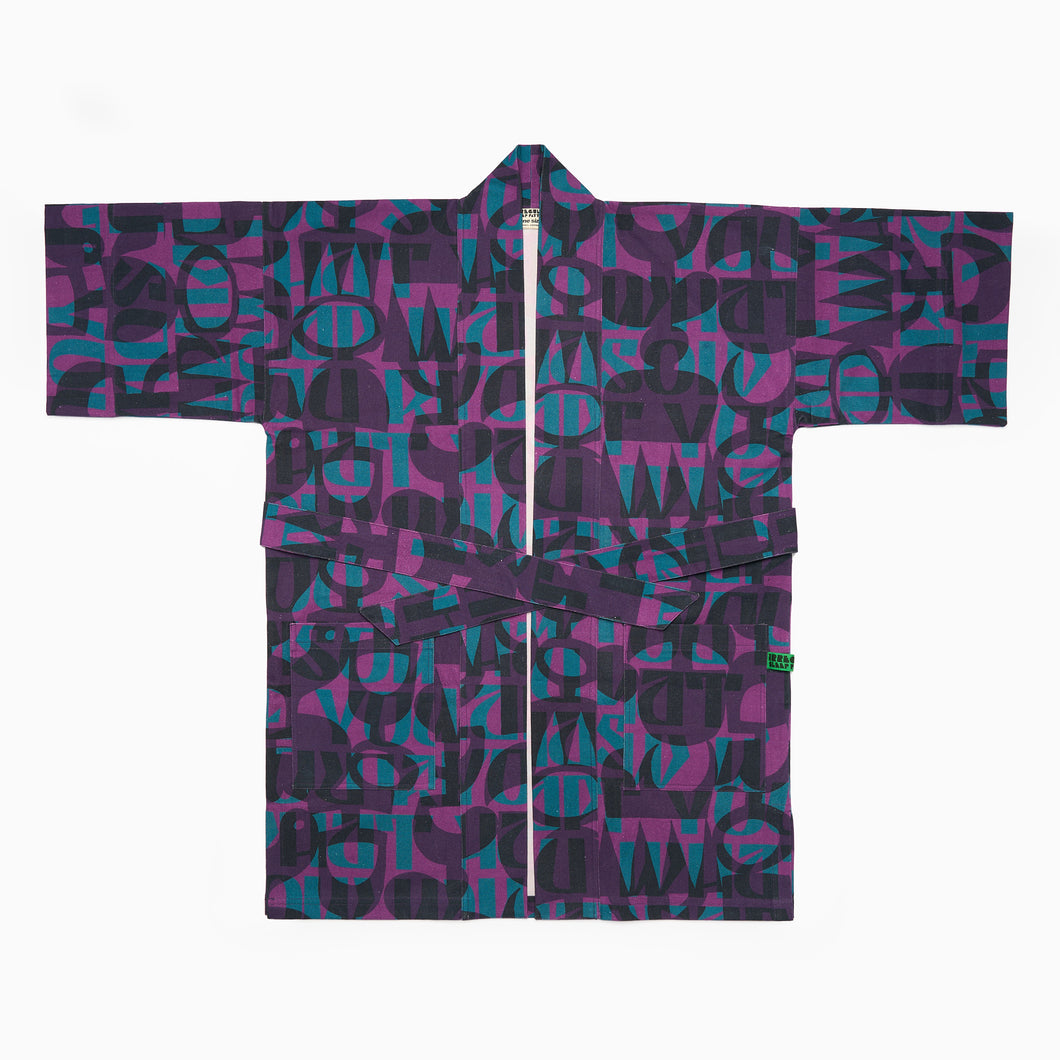 organic cotton kimono-style rob for men and women in colourful abstract purple and blue geometric pattern.