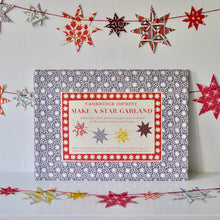 Load image into Gallery viewer, Cambridge Imprint paper star garland made from colourful patterned press-out stars
