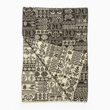 Load image into Gallery viewer, Patterned pure wool scarf with black and white design on a white background
