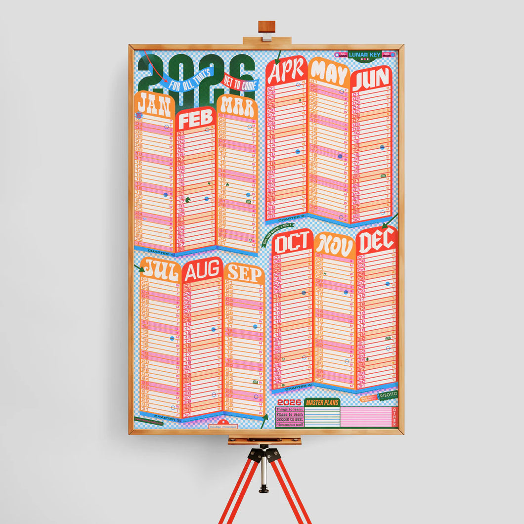 Colorful calendar poster on an easel against a light gray background