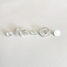 Load image into Gallery viewer, A set of five silver-coloured earrings with assorted shapes displayed on a white background.
