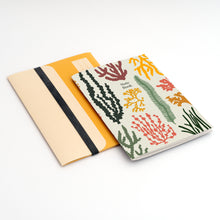 Load image into Gallery viewer, image showing A5 notebook with folder featuring colourful seaweed illustrations 

