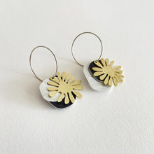 Load image into Gallery viewer, Pair of Tom PIgeon earrings with gold and black floral designs on a white background
