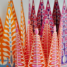 Load image into Gallery viewer, Close up of the six paper crowns by cambridge imprint
