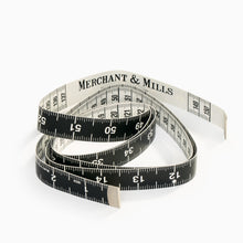 Load image into Gallery viewer, Coiled tailor tape measure by Merchant and Mills showing metric and imperial measurements
