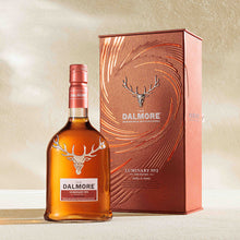 Load image into Gallery viewer, The Dalmore Luminary No.2 single malt whisky bottle shown beside its orange limited edition case

