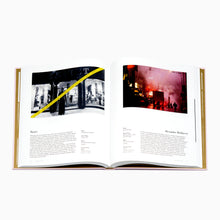 Load image into Gallery viewer, Inside pages of The Fashion Show book showing runway photography and archival content
