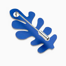 Load image into Gallery viewer, Blue abstract brooch with silver pin on a white background
