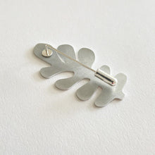 Load image into Gallery viewer, Back of silver leaf-shaped brooch on a white background
