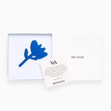 Load image into Gallery viewer, Tom Pigeon Flax Bloom cobalt blue brooch displayed with white gift box packaging
