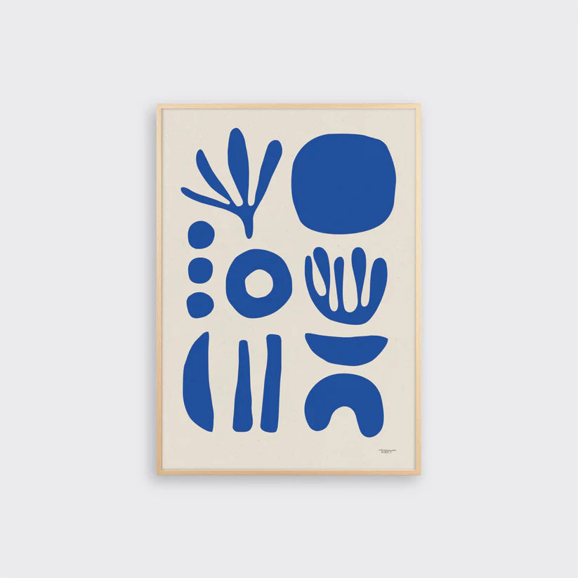 A giclée fine art print featuring abstract botanical and manmade objects in cobalt blue on a white background, framed.