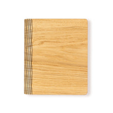 Load image into Gallery viewer, Closed wooden A5 refillable notebook with American oak veneer cover and precision laser-cut spine.
