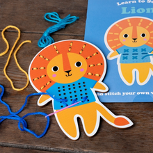 Load image into Gallery viewer, Wooden lion stitch board being threaded with colourful yarn
