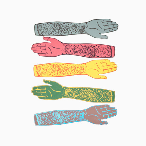 A collection of colorful leather bookmarks, each embossed with a different tattoo design, displayed in a fan-like arrangement against a white background.