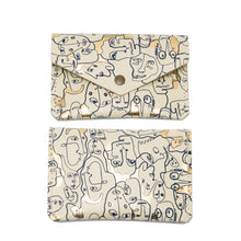 Load image into Gallery viewer, Three leather popper purses with foil embossed designs, in beige, pink, and black color, displayed against a white background.
