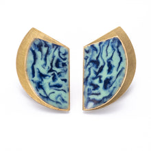 Load image into Gallery viewer, A pair of fanfold earrings with a brushed brass texture and cold enamel in teal and blue shades, with sterling silver posts.

